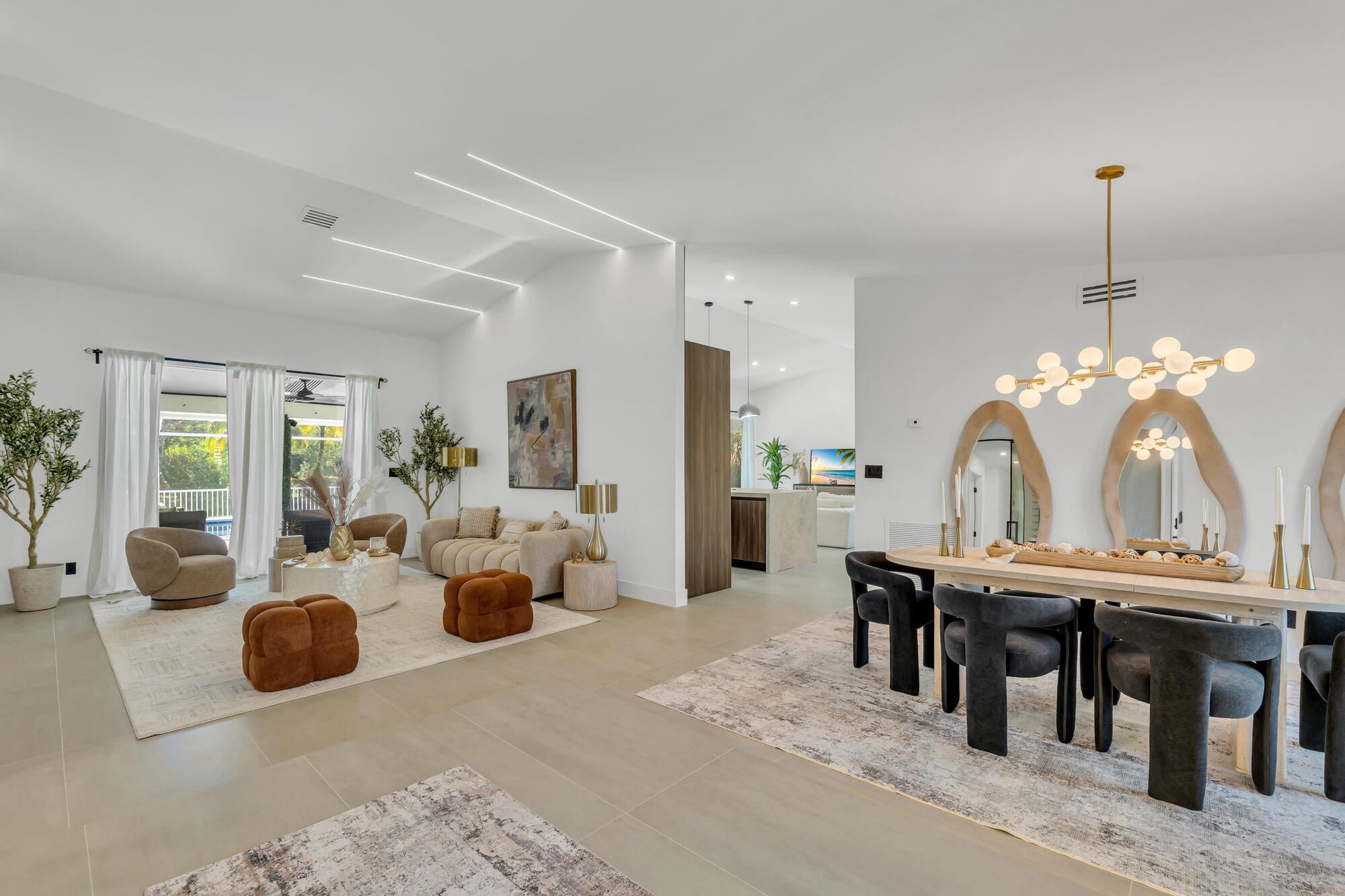 An open living and dining room staged by HAUS by WOW